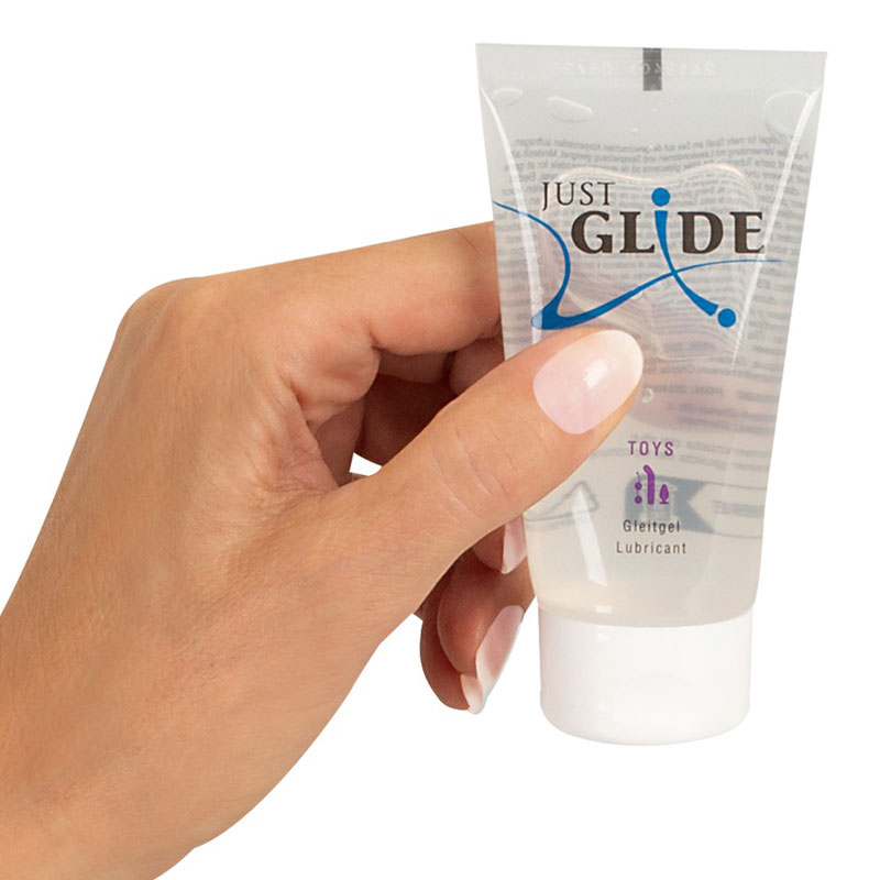 Toylube Tube in einer Hand